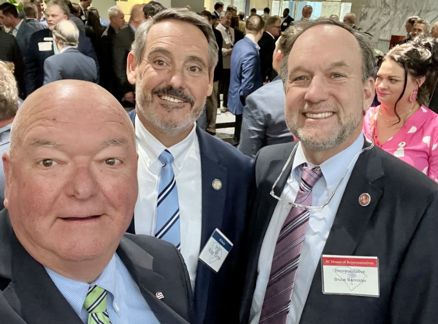 Chuck Saylors with two attendees at a South Carolina legislative event.